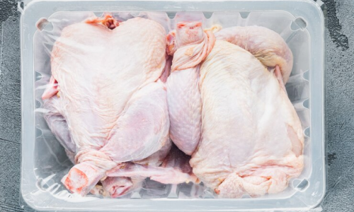 raw-chicken-set-plastic-vacuum-tray-gray-background-top-view_249006-7448